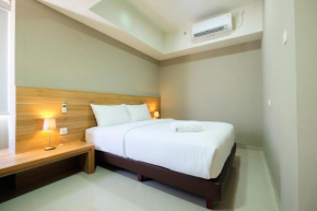 Best Location 1BR Apartment Mustika Golf Residence By Travelio